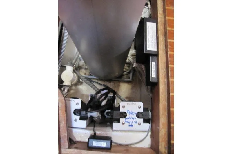 Bella Yacht Photos Pics Electrical components inside a 1983 Nauticat 43 sailboat, showcasing wiring and connections.