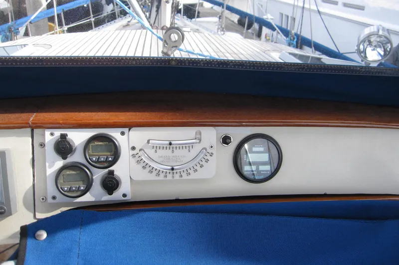 Bella Yacht Photos Pics Control panel of a 1983 Nauticat 43 sailboat with gauges and instruments.