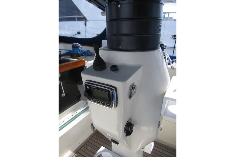 Bella Yacht Photos Pics Cockpit controls of 1983 Nauticat 43 sailboat, featuring navigation equipment and steering mechanisms.
