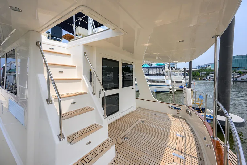 Teal Aweigh Yacht Photos Pics 2011 Grand Banks 41 Europa yacht deck with stairs and marina view.