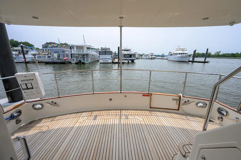 Teal Aweigh Yacht Photos Pics 2011 Grand Banks 41 Europa yacht deck overlooking marina with multiple boats docked.