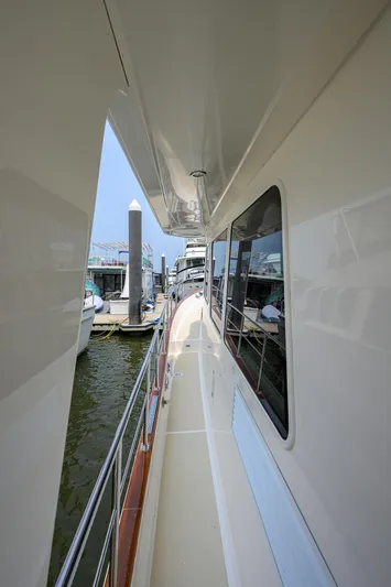 Teal Aweigh Yacht Photos Pics Side deck view of 2011 Grand Banks 41 Europa yacht at marina.