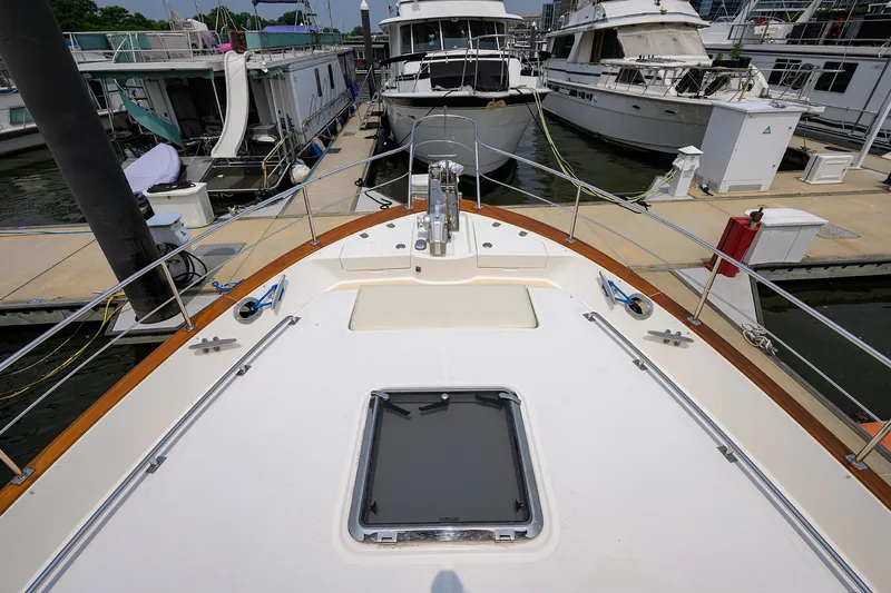 Teal Aweigh Yacht Photos Pics Bow view of 2011 Grand Banks 41 Europa yacht docked at marina.