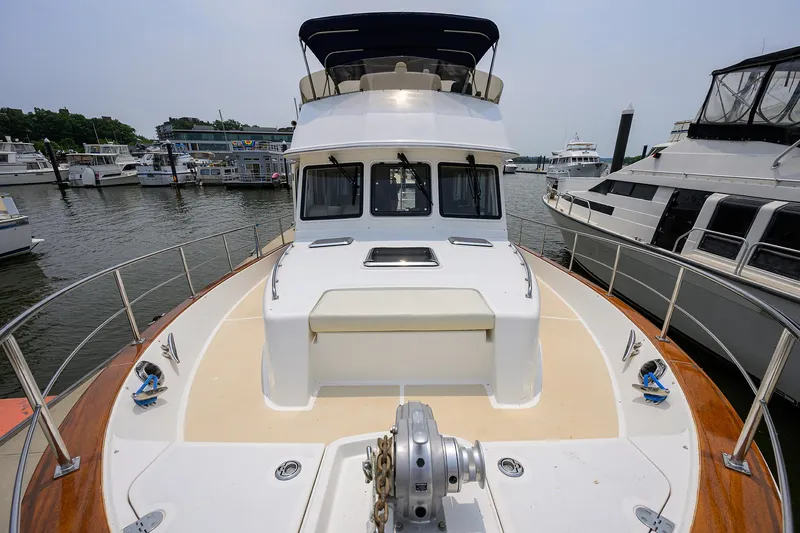 Teal Aweigh Yacht Photos Pics 2011 Grand Banks 41 Europa yacht docked at marina, showcasing spacious deck and sleek design.