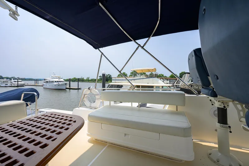 Teal Aweigh Yacht Photos Pics 2011 Grand Banks 41 Europa yacht deck with seating and marina view.