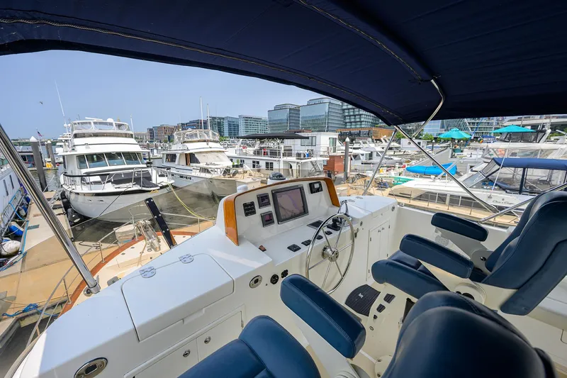 Teal Aweigh Yacht Photos Pics Flybridge view of 2011 Grand Banks 41 Europa yacht docked at a marina.