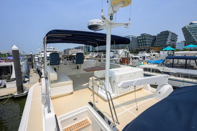 Teal Aweigh Yacht Photos Pics 2011 Grand Banks 41 Europa yacht docked at marina, featuring spacious deck and modern amenities.