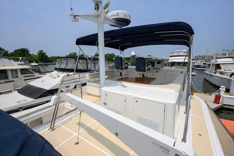 Teal Aweigh Yacht Photos Pics 2011 Grand Banks 41 Europa yacht docked, featuring spacious deck and modern navigation equipment.