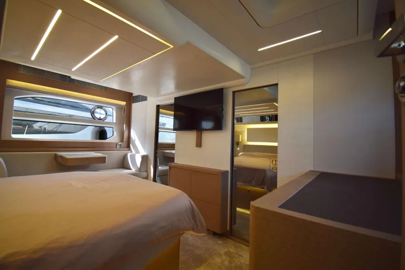  Yacht Photos Pics Luxurious interior of a 2019 Prestige 590 yacht, featuring modern design and ambient lighting.