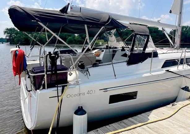  Yacht Photos Pics 2023 Beneteau Oceanis 40.1 sailboat docked by the water, featuring a sleek design.
