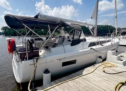  Yacht Photos Pics 2023 Beneteau Oceanis 40.1 sailboat docked at marina under clear skies.