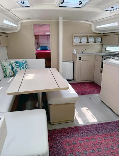  Yacht Photos Pics Interior of 2023 Beneteau Oceanis 40.1 yacht, featuring modern kitchen and dining area.