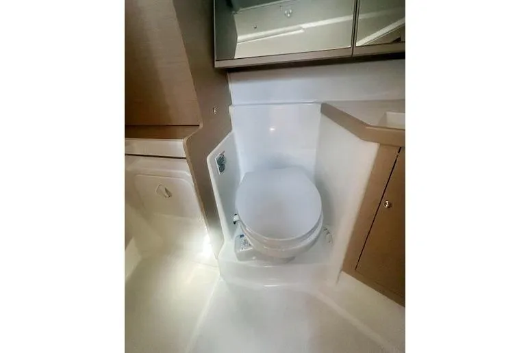  Yacht Photos Pics 2023 Beneteau Oceanis 40.1 yacht bathroom with modern fixtures and compact design.