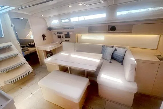  Yacht Photos Pics Luxurious interior of 2023 Beneteau Oceanis 40.1 yacht with modern seating and ambient lighting.