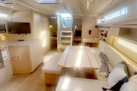  Yacht Photos Pics Interior of 2023 Beneteau Oceanis 40.1 yacht, featuring modern seating and dining area.