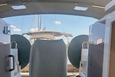  Yacht Photos Pics 2023 Beneteau Oceanis 40.1 yacht interior with covered equipment and visible mast.