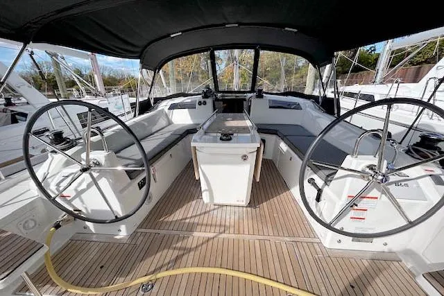  Yacht Photos Pics 2023 Beneteau Oceanis 40.1 yacht cockpit with dual steering wheels and teak flooring.