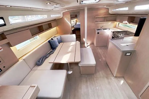  Yacht Photos Pics Interior of 2023 Beneteau Oceanis 40.1 yacht, featuring modern kitchen and dining area.