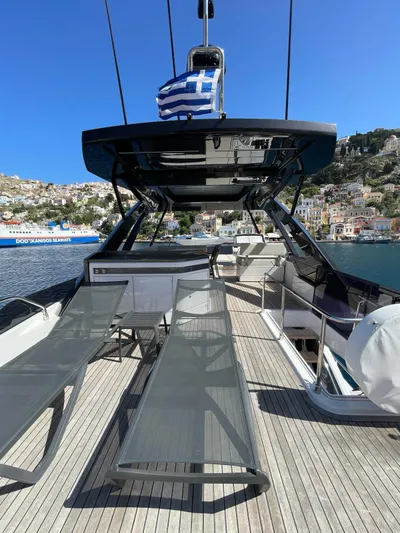 Lf Yacht Photos Pics Luxury 2023 Ferretti Yachts 720 on scenic waterfront, featuring sleek design and sun loungers.