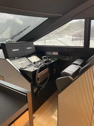 Lf Yacht Photos Pics 2023 Ferretti Yachts 720 helm with modern navigation equipment and luxurious seating.
