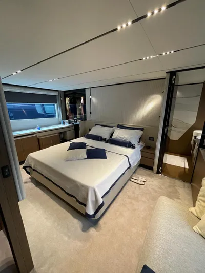 Lf Yacht Photos Pics Luxurious bedroom interior of 2023 Ferretti Yachts 720, featuring elegant bedding and modern design.