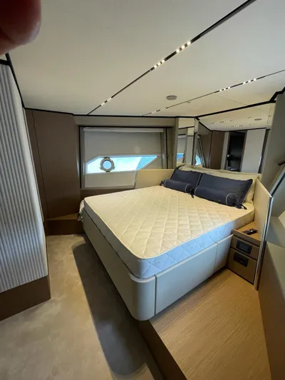 Lf Yacht Photos Pics Luxurious bedroom interior of 2023 Ferretti Yachts 720 with modern design and elegant furnishings.