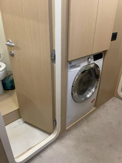 Lf Yacht Photos Pics Laundry area with washing machine in 2023 Ferretti Yachts 720 interior.