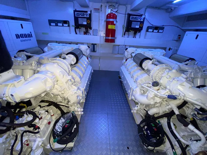 Lf Yacht Photos Pics Engine room of 2023 Ferretti Yachts 720, featuring dual engines and safety equipment.