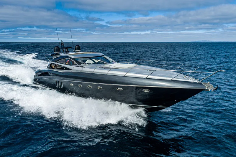  Yacht Photos Pics Luxury Sunseeker Predator 68 yacht cruising on open sea, 2005 model.