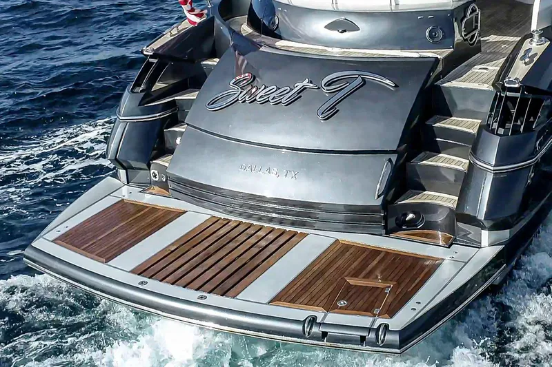  Yacht Photos Pics Sunseeker Predator 68 yacht, 2005 model, with wooden deck, named "Sweet T" in ocean waters.