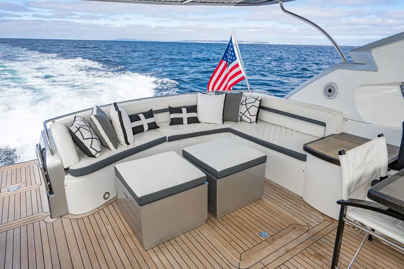  Yacht Photos Pics Luxurious 2005 Sunseeker Predator 68 yacht deck with elegant seating and ocean view.