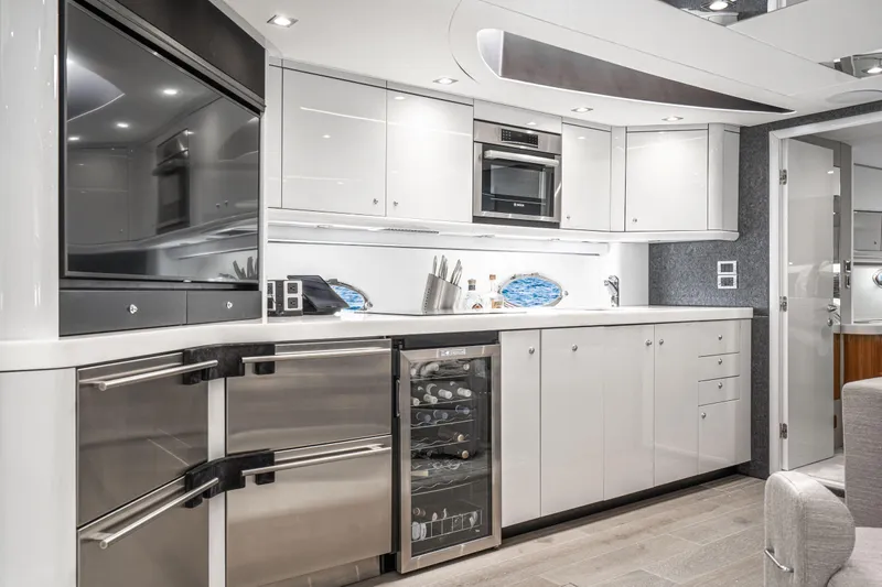  Yacht Photos Pics Luxurious kitchen interior of 2005 Sunseeker Predator 68 yacht with modern appliances.