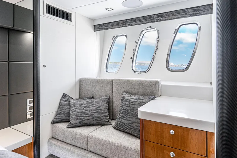  Yacht Photos Pics Luxurious interior of 2005 Sunseeker Predator 68 yacht with plush seating and ocean-view windows.