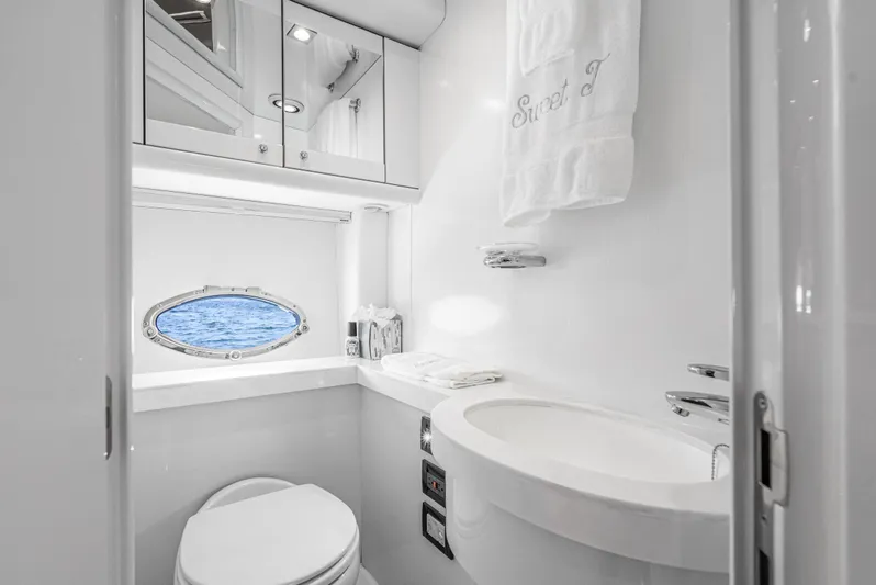  Yacht Photos Pics Luxurious bathroom in 2005 Sunseeker Predator 68 yacht with ocean view porthole.