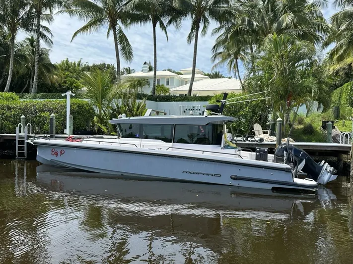  Yacht Photos Pics 2021 Axopar 37 XC Cross Cabin Brabus docked by palm trees.