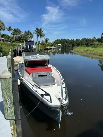  Yacht Photos Pics 2021 Axopar 37 XC Cross Cabin Brabus docked on a sunny day.