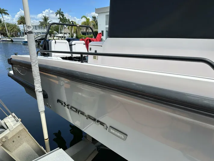  Yacht Photos Pics 2021 Axopar 37 XC Cross Cabin Brabus docked by waterfront homes.
