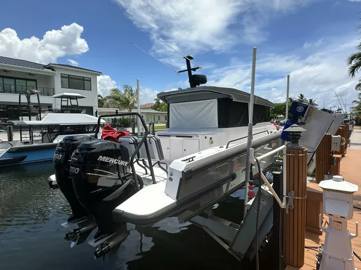  Yacht Photos Pics 2021 Axopar 37 XC Cross Cabin Brabus docked with twin Mercury engines.