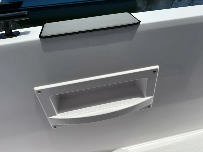  Yacht Photos Pics 2021 Axopar 37 XC Cross Cabin Brabus, interior detail with sleek white panel and handle.