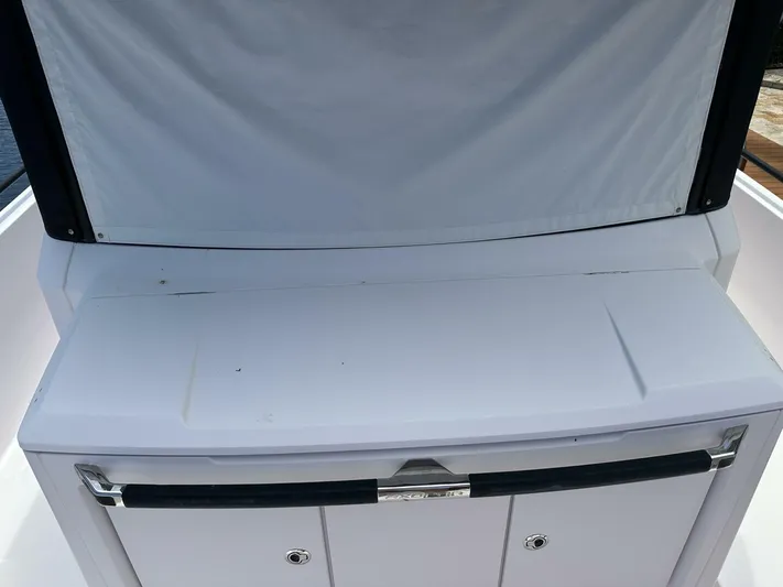  Yacht Photos Pics 2021 Axopar 37 XC Cross Cabin Brabus, rear deck view with storage compartment.