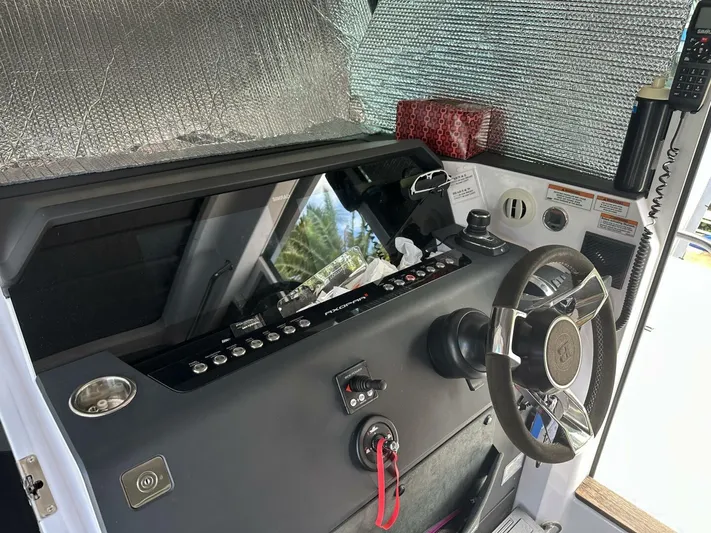  Yacht Photos Pics 2021 Axopar 37 XC Cross Cabin Brabus helm with steering wheel and control panel.