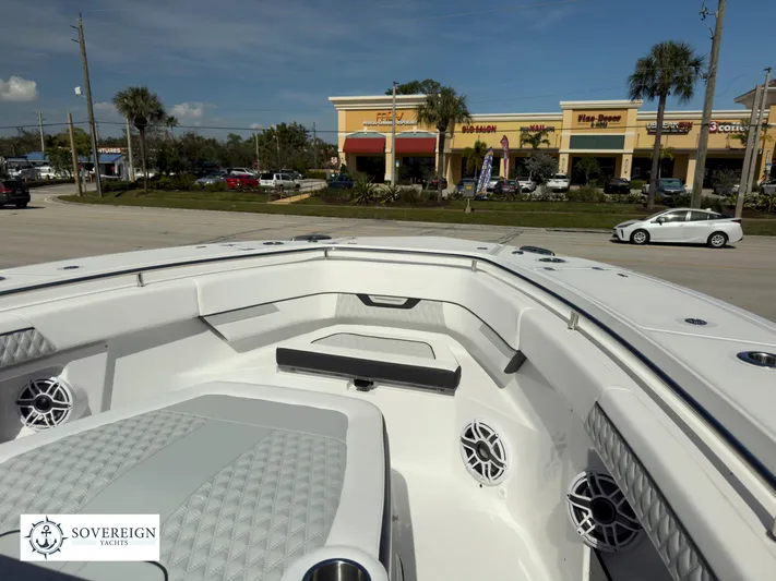 400-102 Yacht Photos Pics 2024 Blackfin 400 boat interior with seating and speakers, Sovereign Yachts logo.