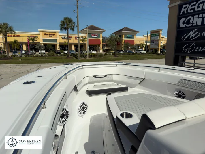 400-102 Yacht Photos Pics 2024 Blackfin 400 boat interior with seating and speakers, Sovereign Yachts logo.