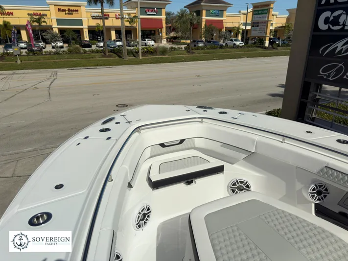 400-102 Yacht Photos Pics 2024 Blackfin 400 boat interior with seating and speakers, showcased by Sovereign Yachts.