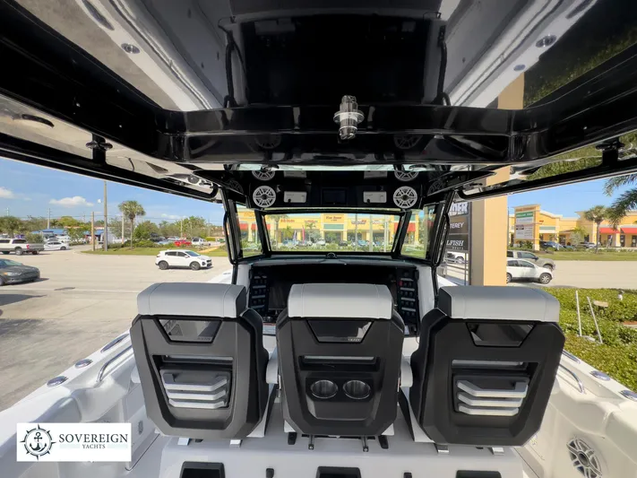 400-102 Yacht Photos Pics 2024 Blackfin 400 boat interior with three seats and dashboard, Sovereign Yachts logo.