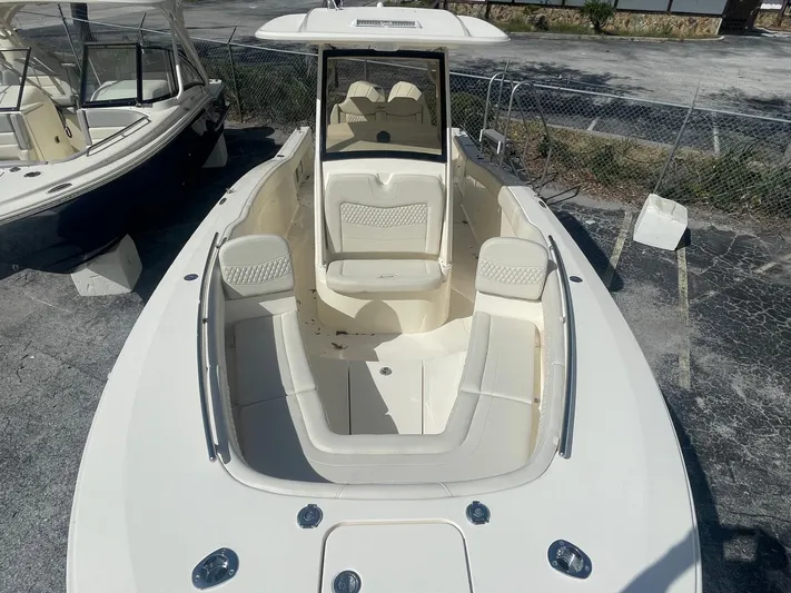  Yacht Photos Pics 2025 Scout 277 LXF boat with spacious seating and sleek design.