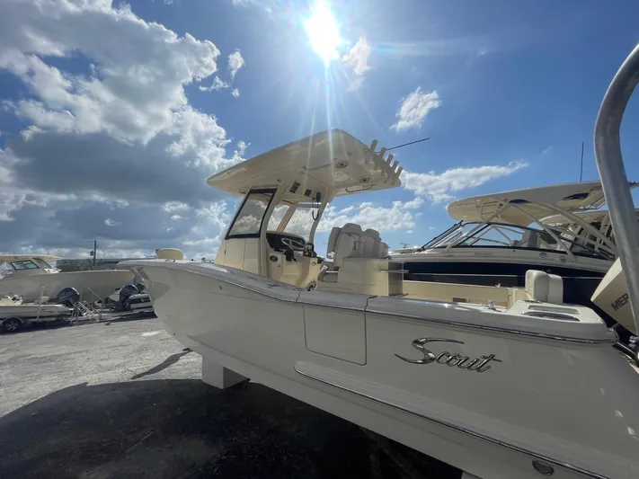  Yacht Photos Pics 2025 Scout 277 LXF boat under sunny sky at marina.