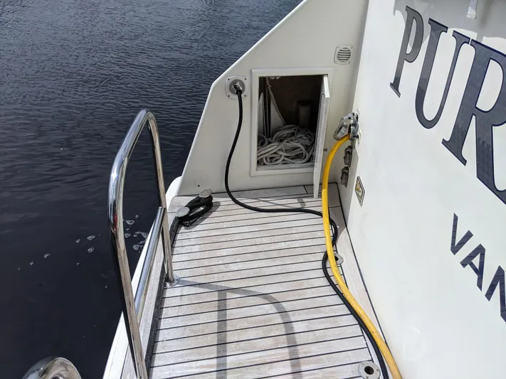 Pura Vida III Yacht Photos Pics 1999 Grand Alaskan Pilothouse boat deck with ropes and cables.