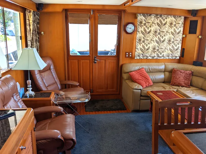 Pura Vida III Yacht Photos Pics Interior of 1999 Grand Alaskan Pilothouse with leather seating and wooden accents.