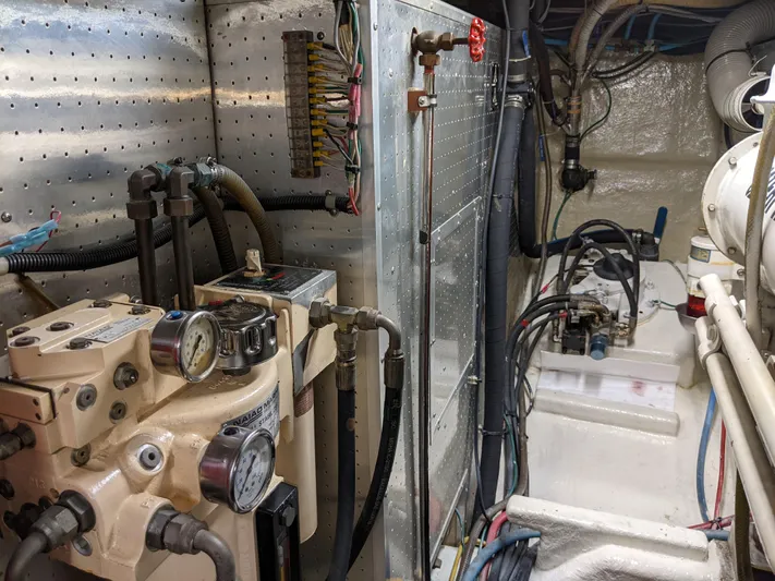 Pura Vida III Yacht Photos Pics Engine room of a 1999 Grand Alaskan Pilothouse yacht with mechanical components.